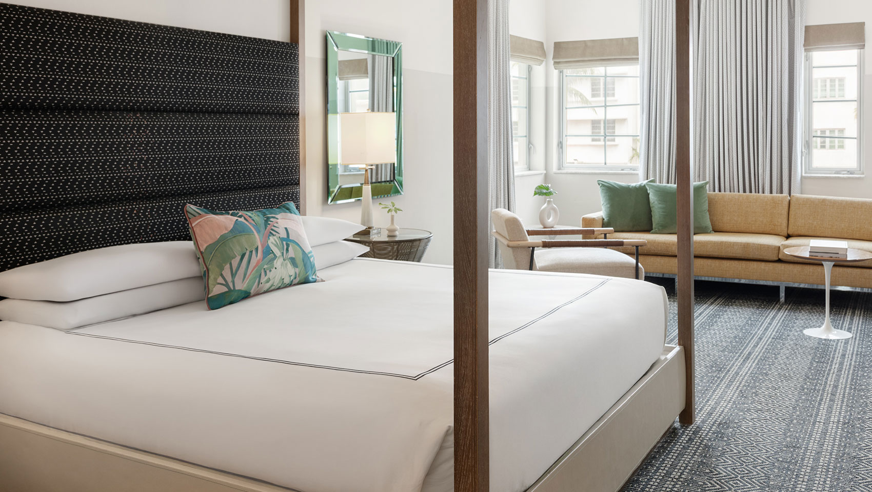 Surfcomber Guestroom with bed and sitting area